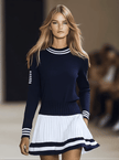 Navy blue FJØRNA mini dress for women, sleeveless with a fitted bodice and flared skirt, shown on a model.
