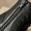 FJØRNA men's leather combat boots with side zipper, orthopedic design, durable soles, and ankle height for rugged style and comfort.