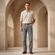 Men’s slim fit grey wash jeans from FJØRNA, casual pants with a modern, tapered design and classic denim texture.