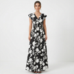 Women's floral print V-neck summer maxi dress by FJØRNA featuring a flowing fabric and vibrant floral pattern.
