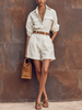 FJØRNA women's cotton-linen shirt jumpsuit with lapel collar, long sleeves, and button-down front, styled as pants.