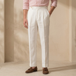 FJØRNA men's linen straight-leg trousers with high waist and pleats, displaying the lightweight fabric and tailored fit.