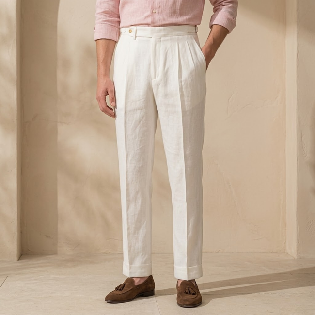 FJØRNA men's linen straight-leg trousers with high waist and pleats, displaying the lightweight fabric and tailored fit.