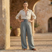 FJØRNA women's high waist elastic wide leg trousers, stylish and comfortable pants with a relaxed fit, shown on a model.