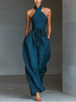FJØRNA women's linen cross halter jumpsuit with wide-leg pants, tie waist, and side pockets, perfect for casual wear.