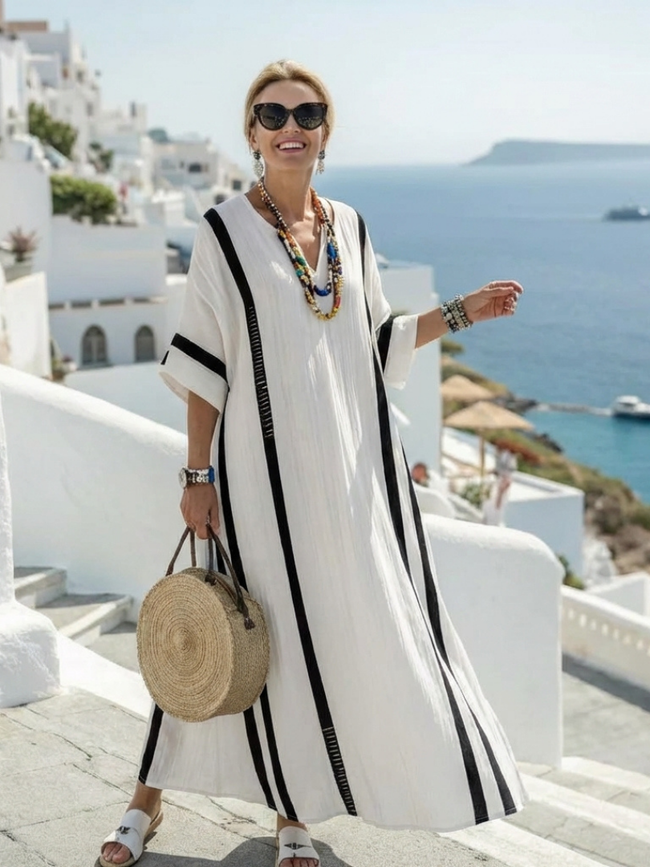 FJØRNA women's summer maxi dress with blue and white stripes, short sleeves, flowy lightweight fabric, perfect for warm weather.