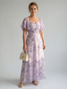 FJØRNA women's summer midi dress with floral pattern, square neckline, and flutter sleeves, perfect for warm weather.