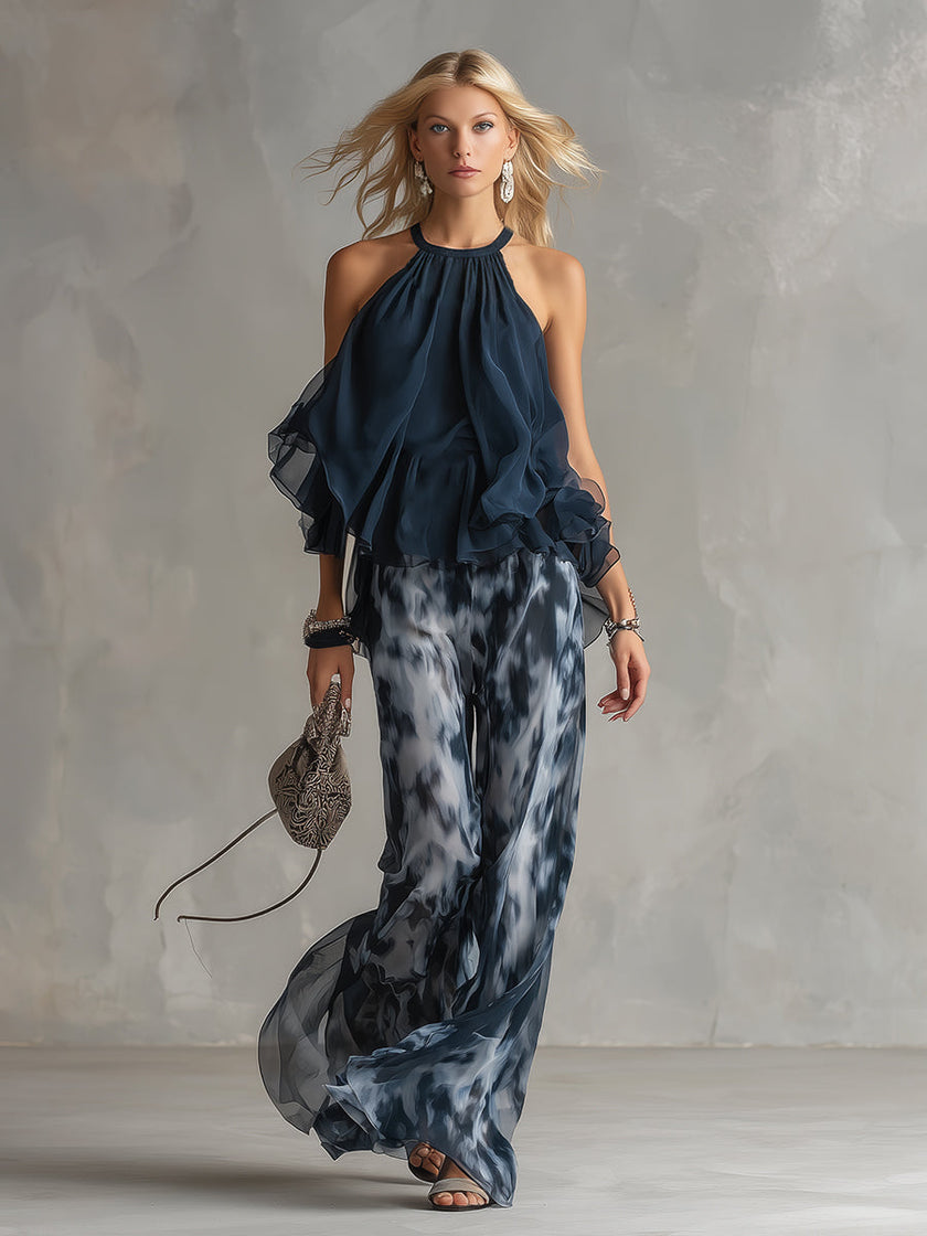 Navy blue printed wide-leg women's pants by FJØRNA, featuring a stylish design and comfortable fit.