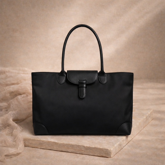 FJØRNA women's tote bag for school, featuring a spacious design with sturdy handles and stylish appearance.