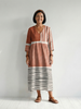 FJØRNA women's summer midi dress with striped pattern, long sleeves, and flowy fabric, perfect for warm weather.