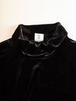 Elegant black velvet and satin midi dress for women by FJØRNA, featuring a fitted silhouette and stylish design.