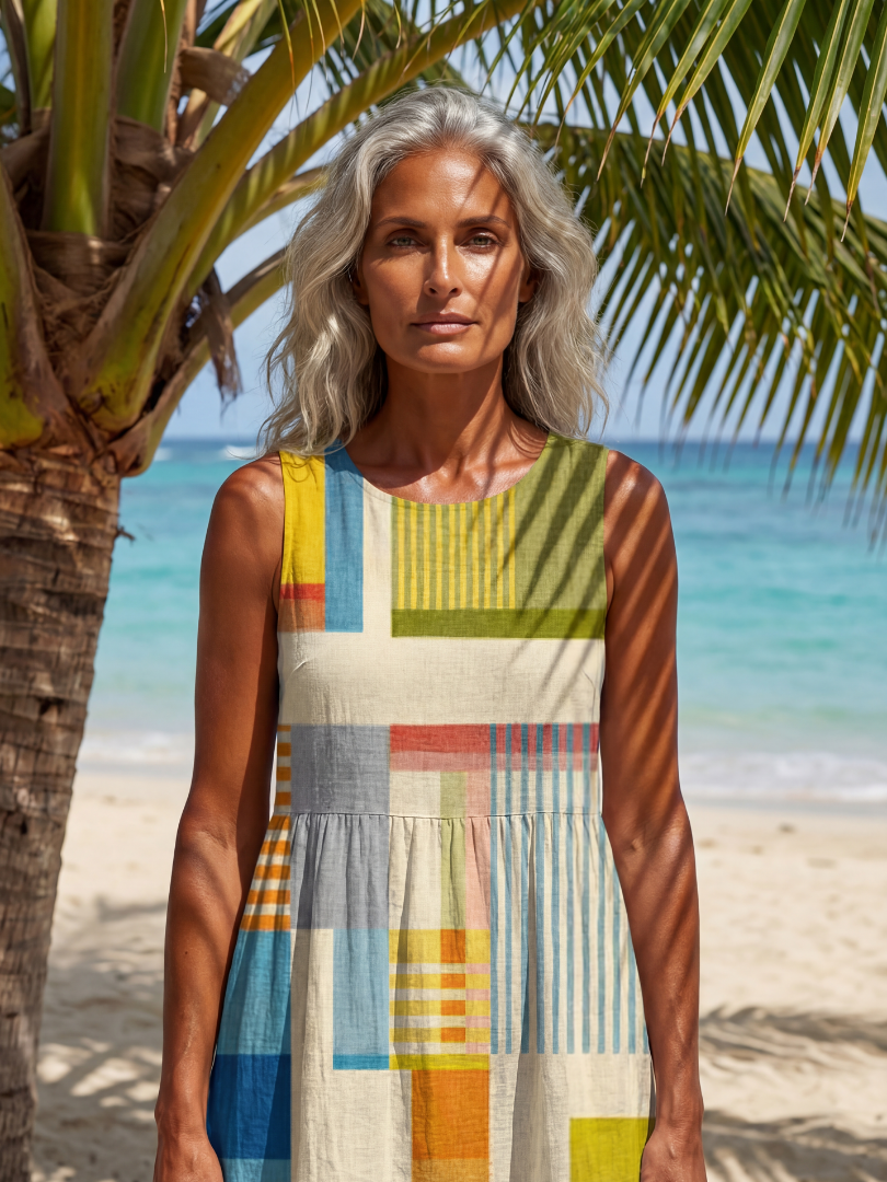 Flowy sleeveless summer midi dress for women by FJØRNA, featuring a wrap design and breathable fabric.