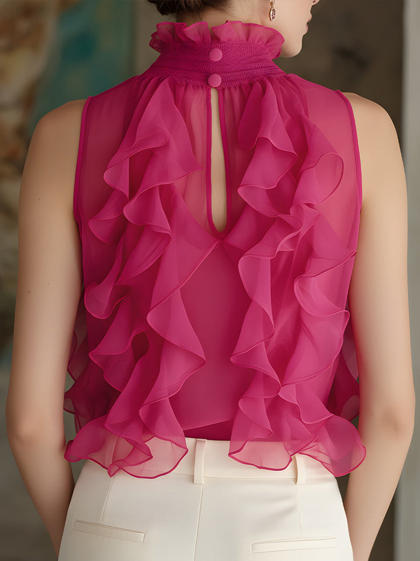 Magenta chiffon blouse for women with high neck, sleeveless design, and ruffle details by FJØRNA.