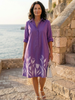 FJØRNA women's floral wrap evening dress with elegant design, featuring a fitted waist and flowing skirt for special occasions.