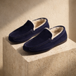 Men's FJØRNA wool slippers with soft, cozy fabric and slip-on design, ideal for comfortable indoor footwear.