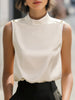 Ivory satin high-neck sleeveless blouse for women by FJØRNA, stylish top with elegant satin fabric and sleeveless design.