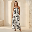 FJØRNA two-piece women’s tropical print suit set with wide-leg pants and sleeveless top, vibrant floral pattern.