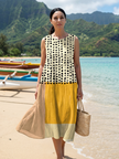 FJØRNA women's summer midi dress with polka dots, sleeveless design, lightweight fabric, perfect for warm weather.