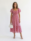 FJØRNA women's floral summer midi dress with puff sleeves and wrap design, perfect for warm-weather occasions.