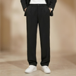 FJØRNA men's pleated relaxed fit trousers, stylish and comfortable pants with a classic design, shown in a neutral color.