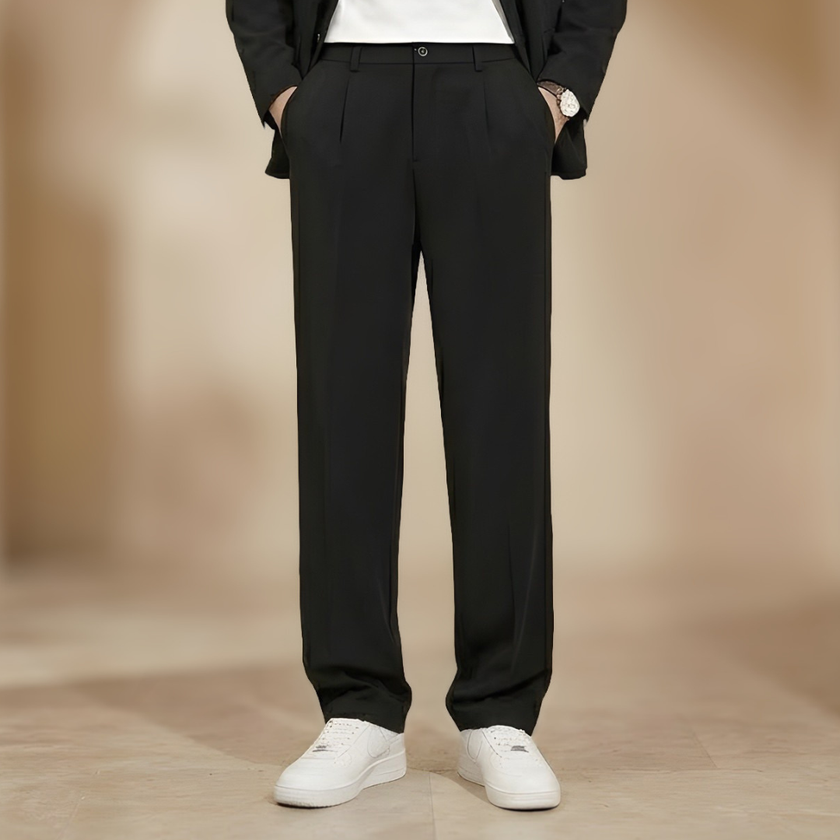 FJØRNA men's pleated relaxed fit trousers, stylish and comfortable pants with a classic design, shown in a neutral color.