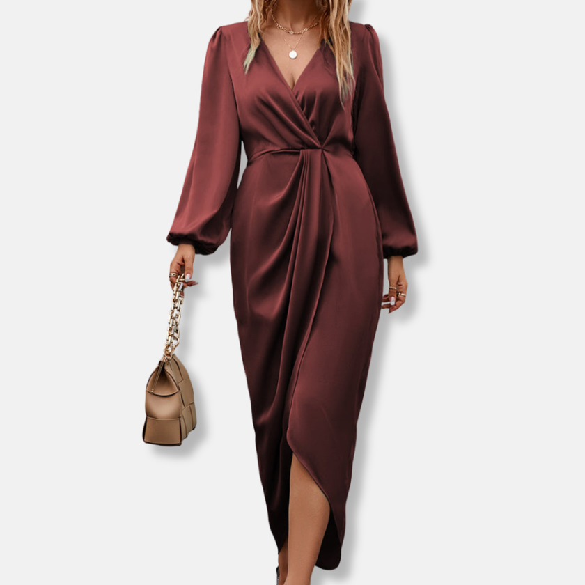 Elegant FJØRNA women's midi dress with V-neck and long sleeves, shown in a stylish silhouette on a model.