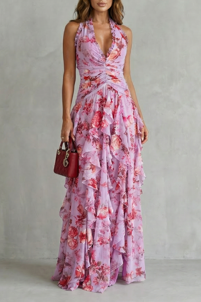 FJØRNA elegant floral maxi dress for women with a halter neck and flowing design, perfect for summer occasions.