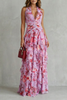 FJØRNA elegant floral maxi dress for women with a halter neck and flowing design, perfect for summer occasions.