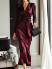 FJØRNA burgundy satin wrap dress with waist tie detail, elegant and flowy evening dress for formal occasions.