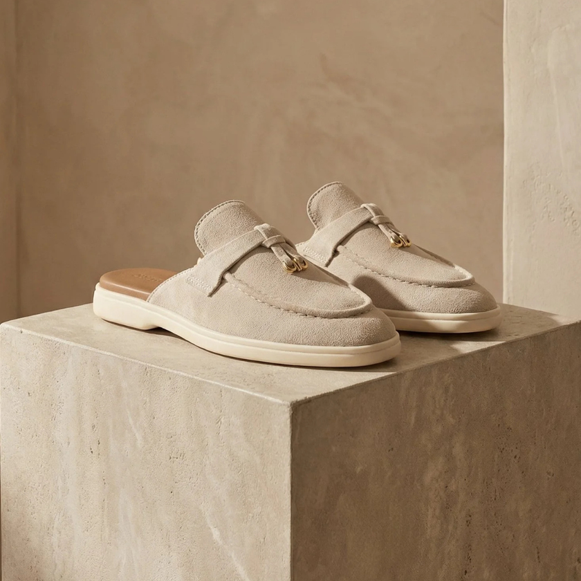 Red sheepskin slip-on sandals for women by FJØRNA, featuring a comfortable open-toe design and soft, plush material.