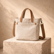 Large FJØRNA canvas messenger bag for women with adjustable strap and spacious interior, stylish and practical for everyday use.