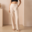 FJØRNA women's straight leg trousers, stylish pants with a sleek fit, shown in a neutral color, perfect for casual or office wear.