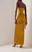 FJØRNA strapless satin maxi dress with draped design, elegant and flowing, suitable for formal occasions.