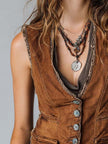 FJØRNA caramel washed denim button-up waistcoat vest worn as a sleeveless tank top, showcasing front button details and denim texture.