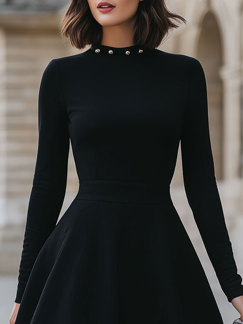 FJØRNA black studded neckline dress for women, elegant black dress with studded detail, suitable for formal and stylish occasions.