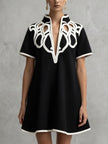 FJØRNA white A-line loose contrast color V-neck mini dress featuring a relaxed fit and stylish design.