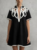 FJØRNA white A-line loose contrast color V-neck mini dress featuring a relaxed fit and stylish design.