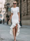 FJØRNA asymmetric ruffled hem fitted midi dress in soft fabric, featuring a stylish asymmetric design and elegant ruffle details.