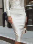 FJØRNA white long-sleeve twist-front shirt dress for women, featuring a classic collar and button-down front.