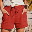 FJØRNA women's lightweight summer shorts with wide-leg design, drawstring waist, and side pockets, perfect for warm weather.