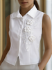 White sleeveless women's blouse with floral embroidery and 3D appliqué by FJØRNA, featuring a lightweight, elegant top design.