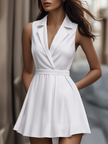 FJØRNA white pleated mini shirt dress with a collared neckline and short sleeves, styled with a fitted waist and pleated skirt.