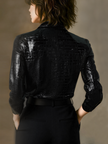 Black embossed crocodile texture sleeveless women's top by FJØRNA, glossy finish with a sleek, textured design.