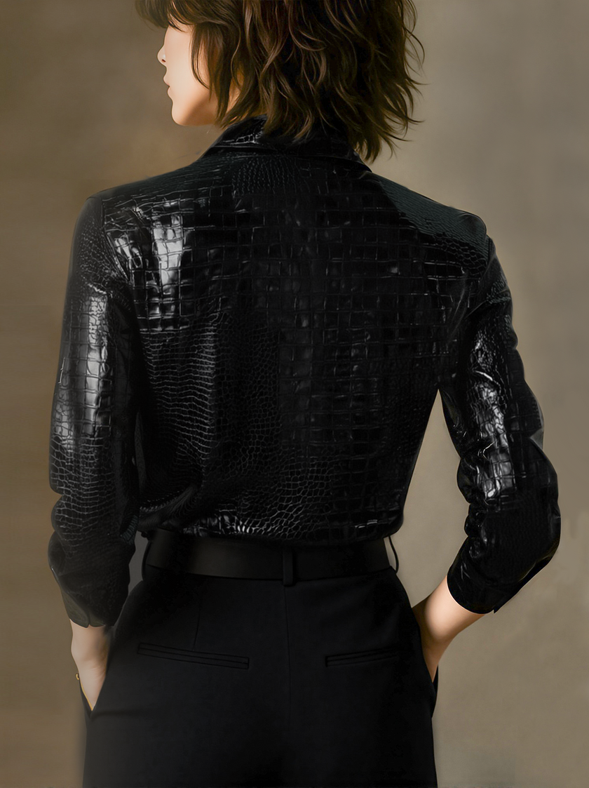Black embossed crocodile texture sleeveless women's top by FJØRNA, glossy finish with a sleek, textured design.