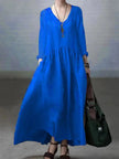 FJØRNA casual cotton and linen V-neck dress with a loose fit, perfect for casual wear or wedding occasions, shown on a model