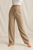 FJØRNA women's joggers, stylish and comfortable casual pants in soft cashmere fabric, shown in a relaxed fit.