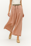 FJØRNA women's linen tapered trousers, stylish and comfortable pants with a relaxed fit, shown in a natural linen fabric.