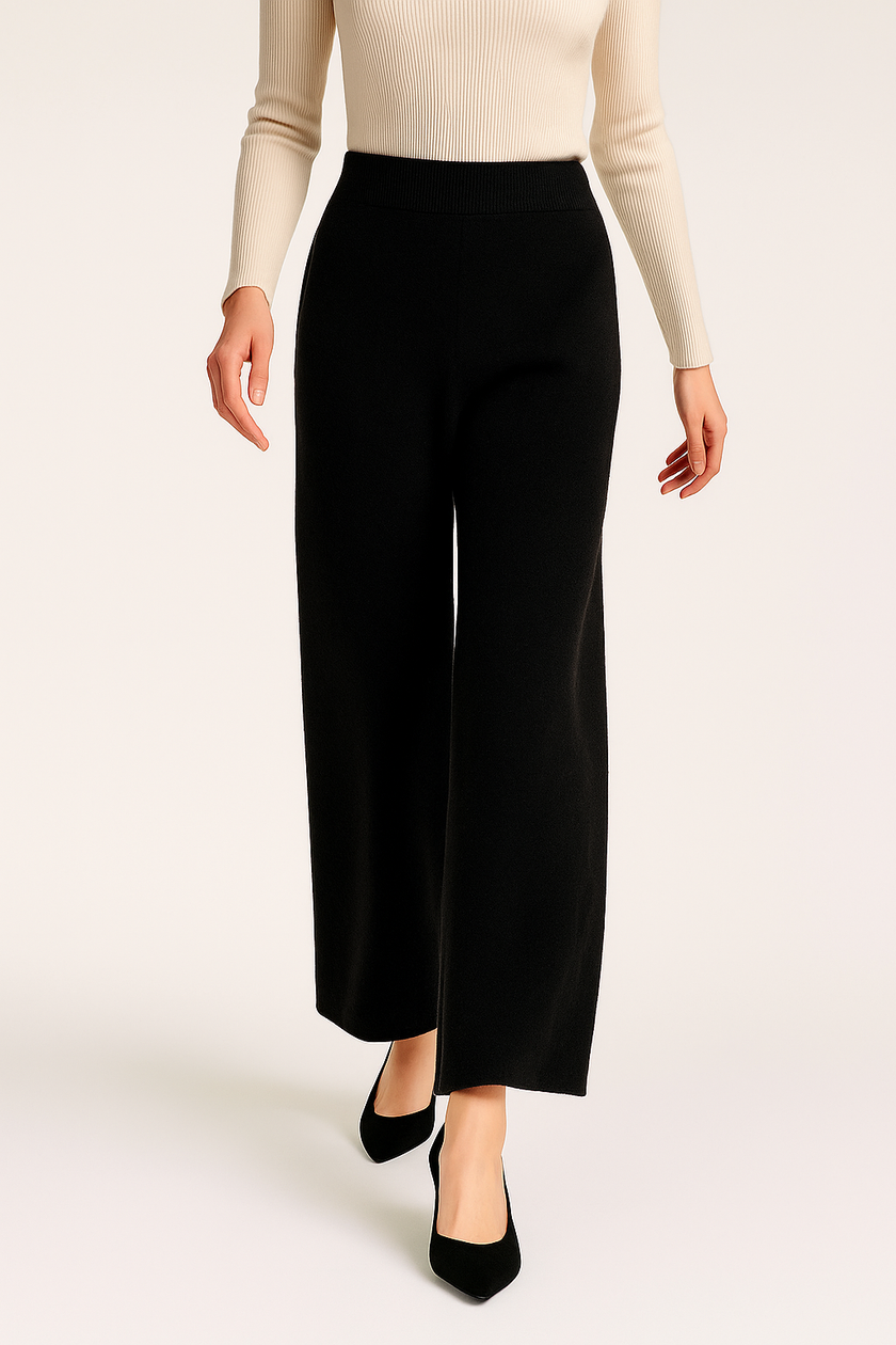FJØRNA women's joggers pants in soft cashmere fabric, shown in a relaxed fit with a comfortable waistband and tapered legs.