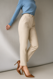 FJØRNA wool blend high waist tapered trousers for women, shown in a stylish ensemble, featuring a tailored fit and classic design.