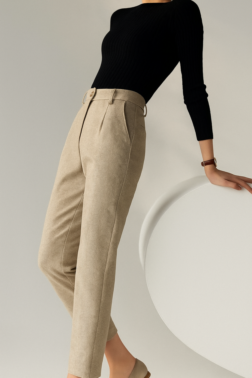 FJØRNA wool blend high waist tapered trousers for women, shown in light color, styled with a casual top.